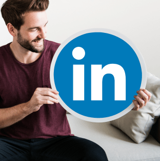 man holding linkedin logo