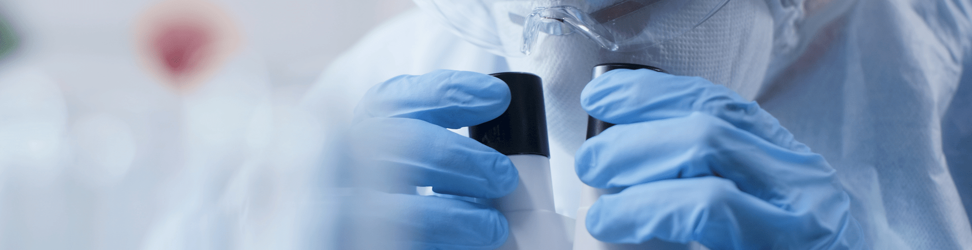 researcher with microscope close-up