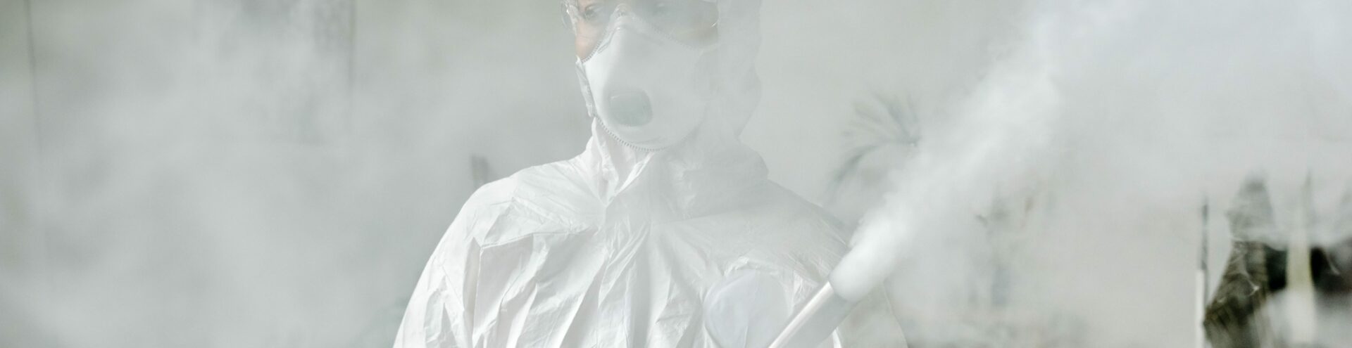 man with fumigation tube