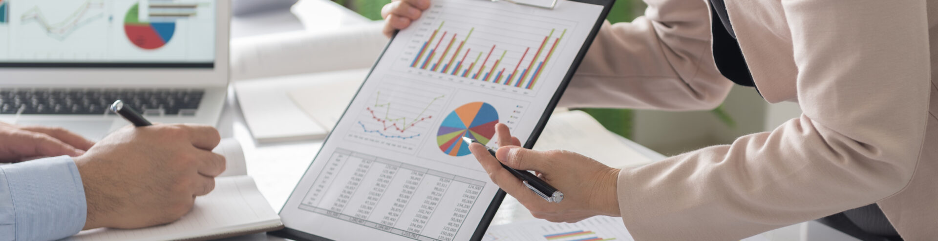 businesswomen pointing business document