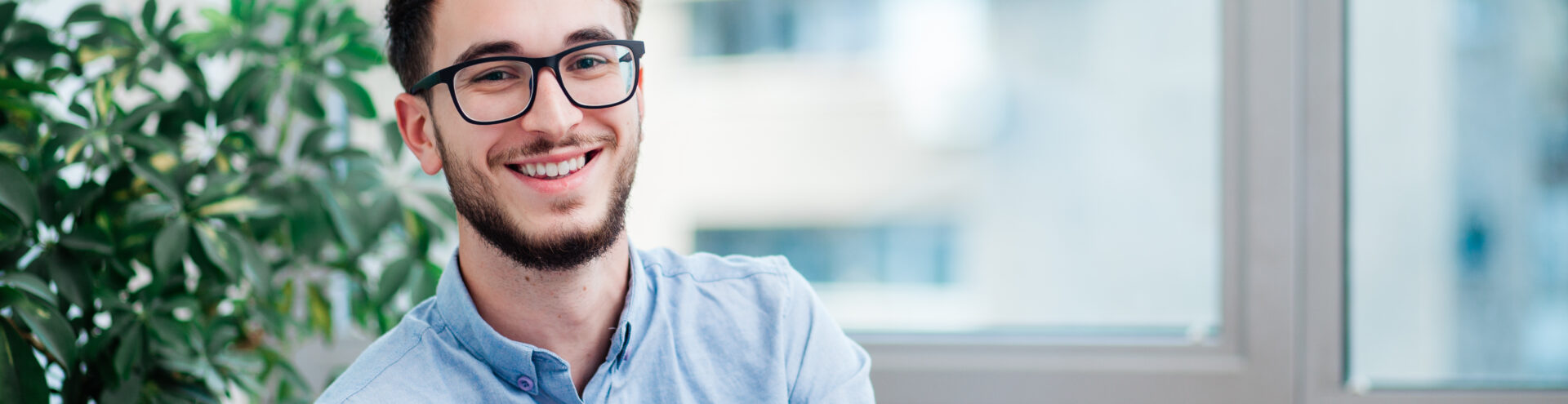 Young businessman in office working on laptop