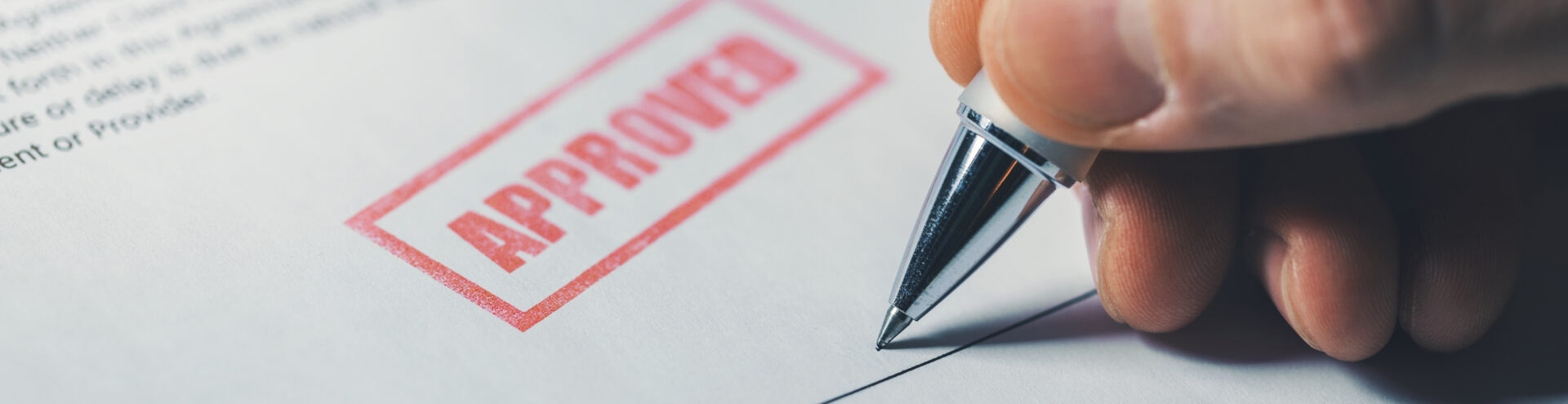 hand sign approved business contract closeup